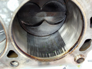 Photo 2: Scoring on the thrust side of cylinder walls 1 and 4 was very apparent on the first two engines.