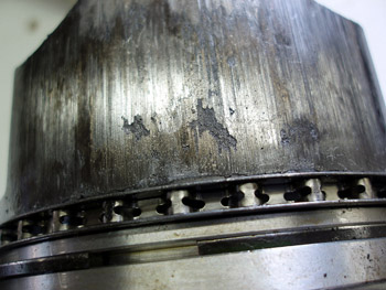 Photo 5: I suspected a problem with the metallurgy of the piston because metal is actually torn from the piston skirt.